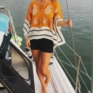 This is an Anthropologie Floreat Embroidered Paisley Boho Poncho Sunglow